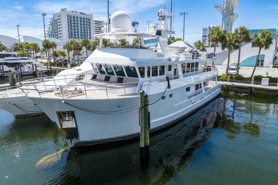Luxury yacht docked at marina, ABD 90 Explorer, 1996 model, sunny day.