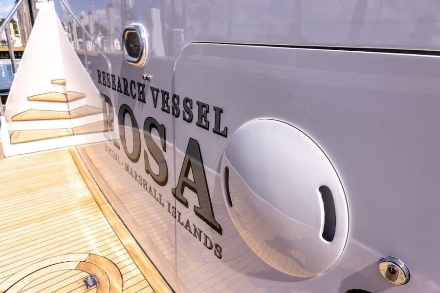 Research vessel "Rosa" docked, featuring wooden deck and sleek design, ABD 90 Explorer 1996.