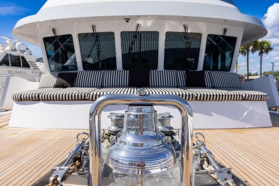 Luxury yacht deck with striped seating and polished bell, ABD 90 Explorer, 1996 model.