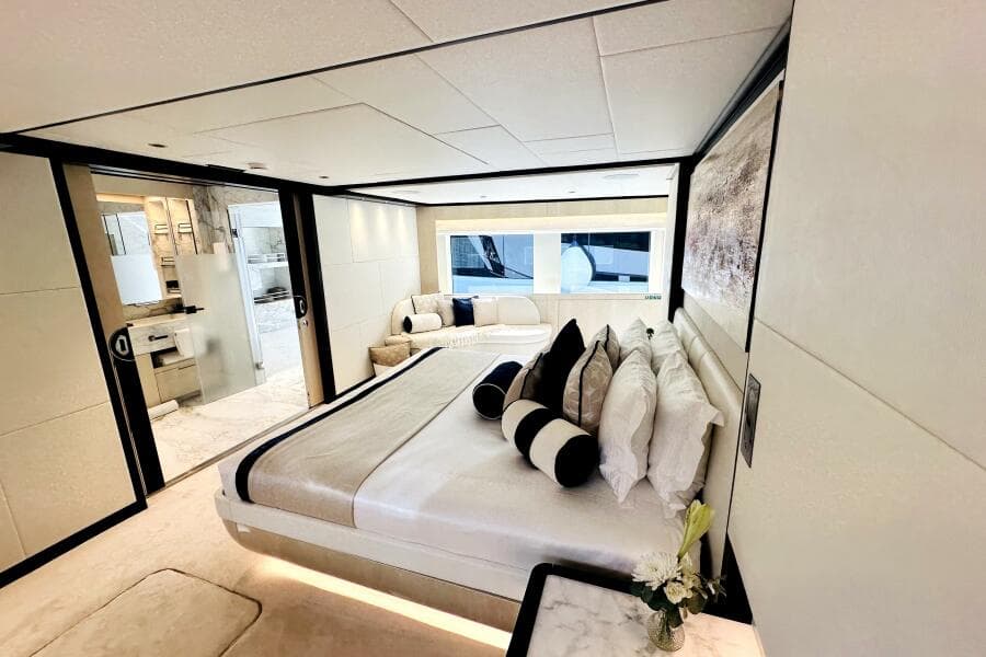 Luxurious bedroom interior of 2023 Majesty 120 yacht with modern design and elegant decor.