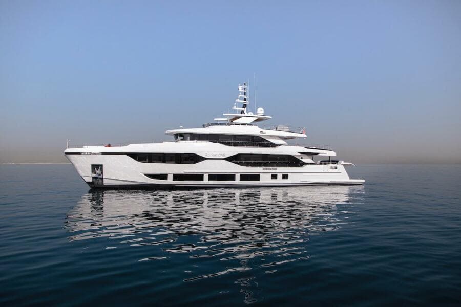Luxurious 2023 Majesty 120 yacht on calm sea under clear blue sky.