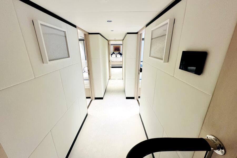 Luxurious hallway interior of 2023 Majesty 120 yacht, featuring modern design and elegant decor.