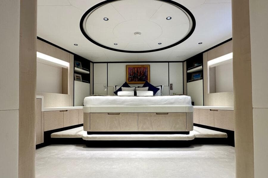 Luxurious bedroom interior of 2023 Majesty 120 yacht with modern design and elegant furnishings.