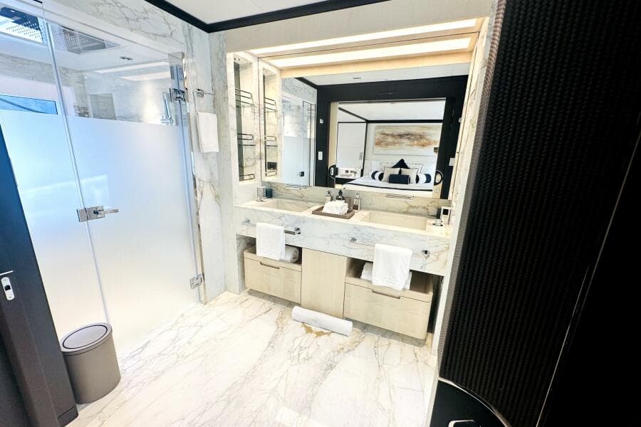Luxurious marble bathroom in 2023 Majesty 120 yacht, featuring modern fixtures and elegant design.