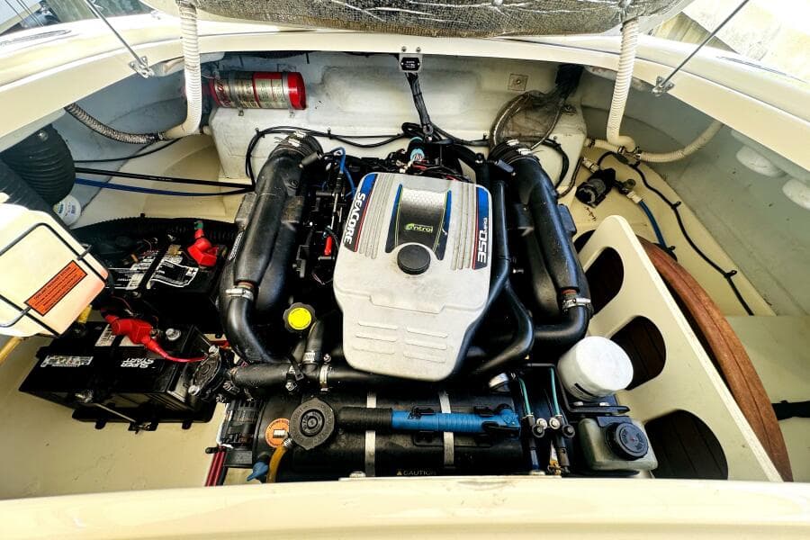 Engine compartment of a 2013 Chris-Craft Corsair 22 boat, featuring a powerful 350 MAG engine.