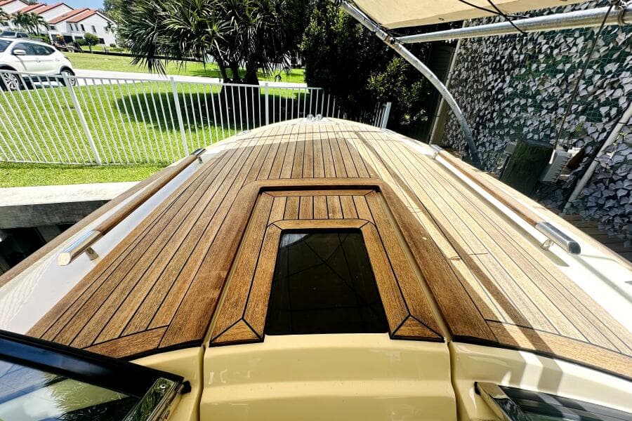 2013 Chris-Craft Corsair 22 boat with sleek wooden deck design.