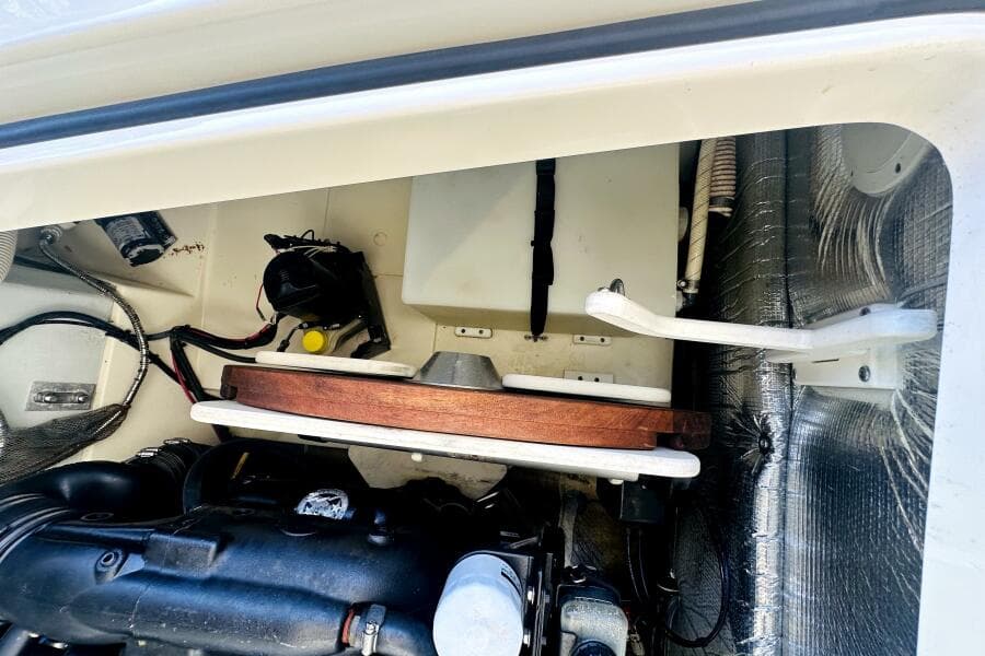 Engine compartment of a 2013 Chris-Craft Corsair 22 boat, showcasing mechanical components.