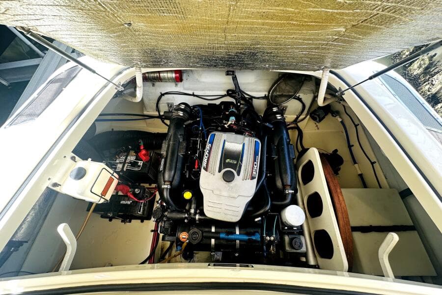 Engine compartment of 2013 Chris-Craft Corsair 22, showcasing a powerful inboard motor.