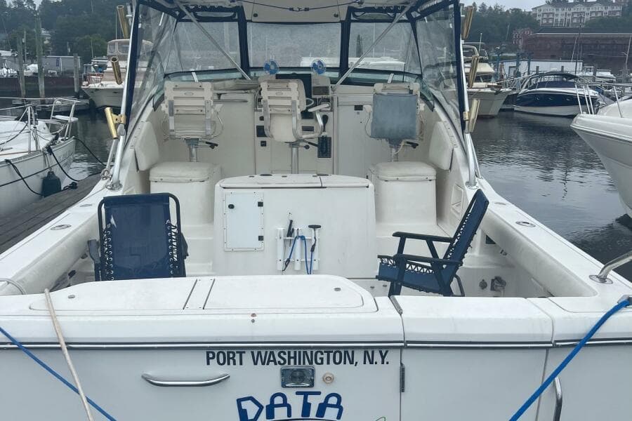 2001 Pursuit 3000 Offshore boat docked in Port Washington, N.Y., with seating and equipment.