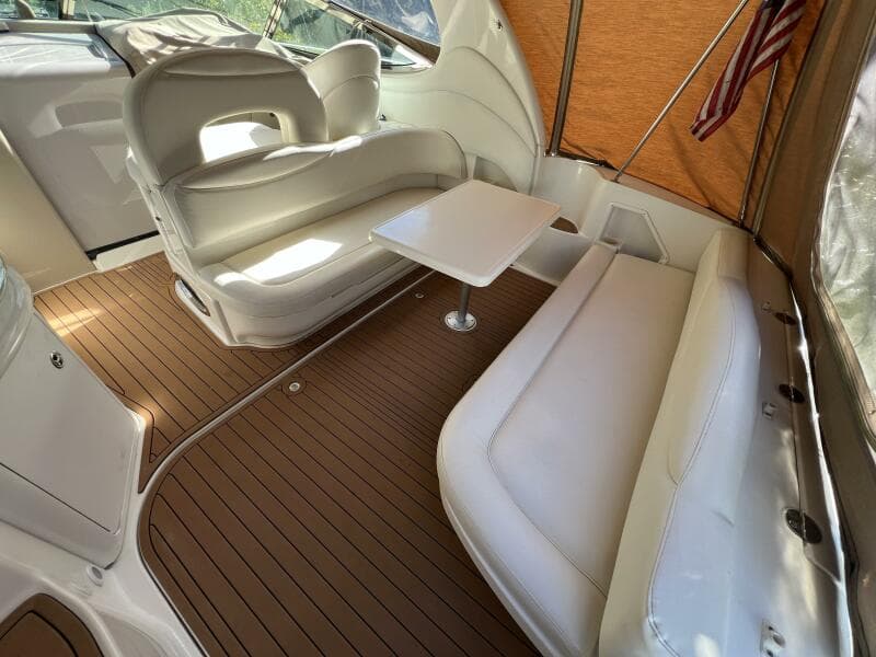 2002 Sea Ray 360 Sundancer Aft Seating with Removable table and Faux Teak SeaDek in the Cockpit looking forward