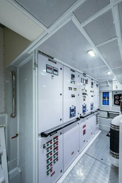 Engine room of 2020 Majesty 140 yacht with control panels and equipment.