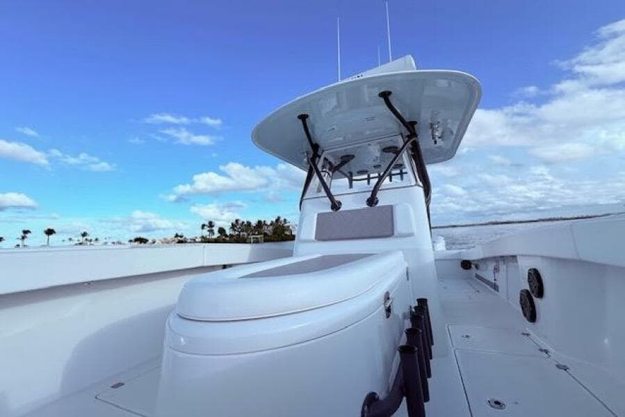 2019 Freeman 34 boat with sleek design, open deck, and clear blue sky background.