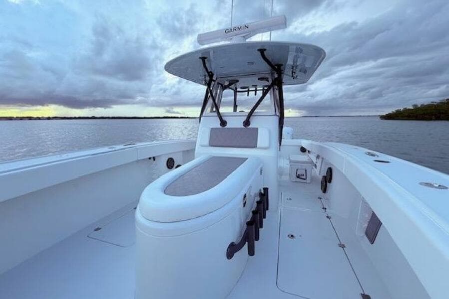 2019 Freeman 34 boat on calm water under cloudy sky.