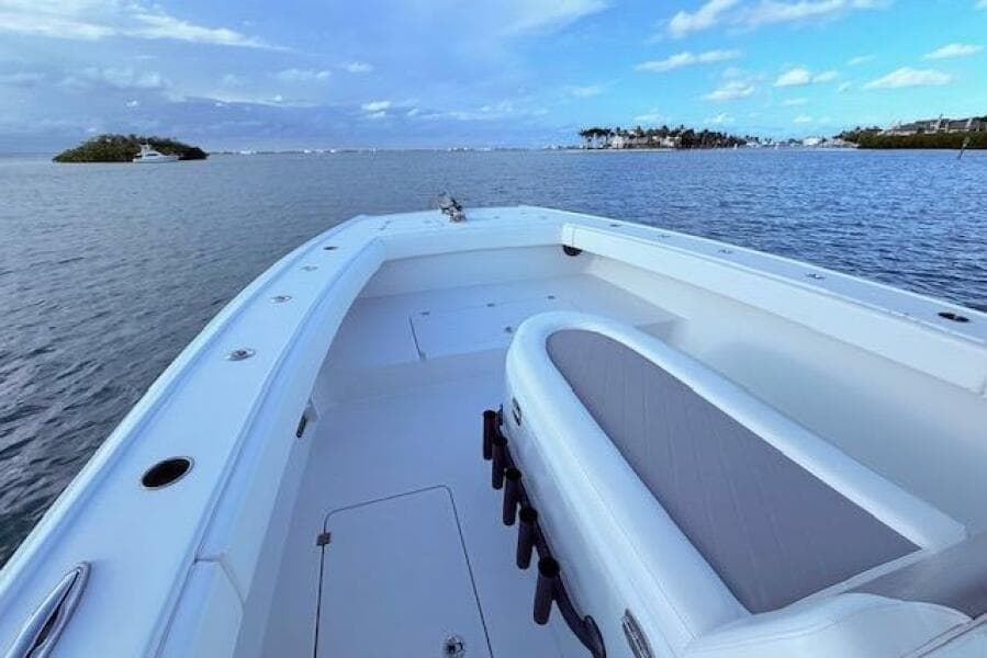 2019 Freeman 34 boat on calm waters with scenic island view.