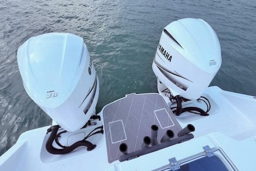 Twin Yamaha outboard engines on a 2019 Freeman 34 boat, viewed from the stern.