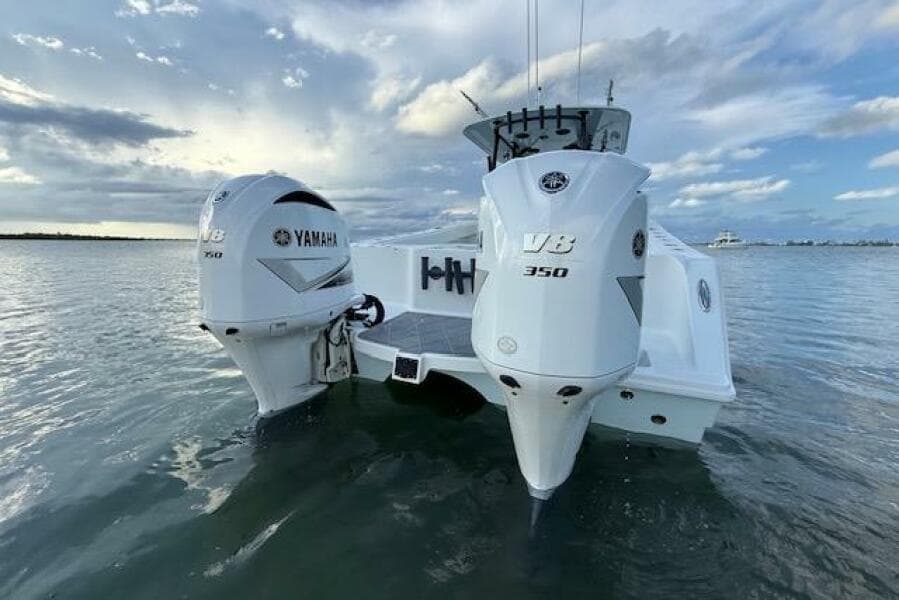 2019 Freeman 34 boat with twin Yamaha V8 350 engines on calm water.