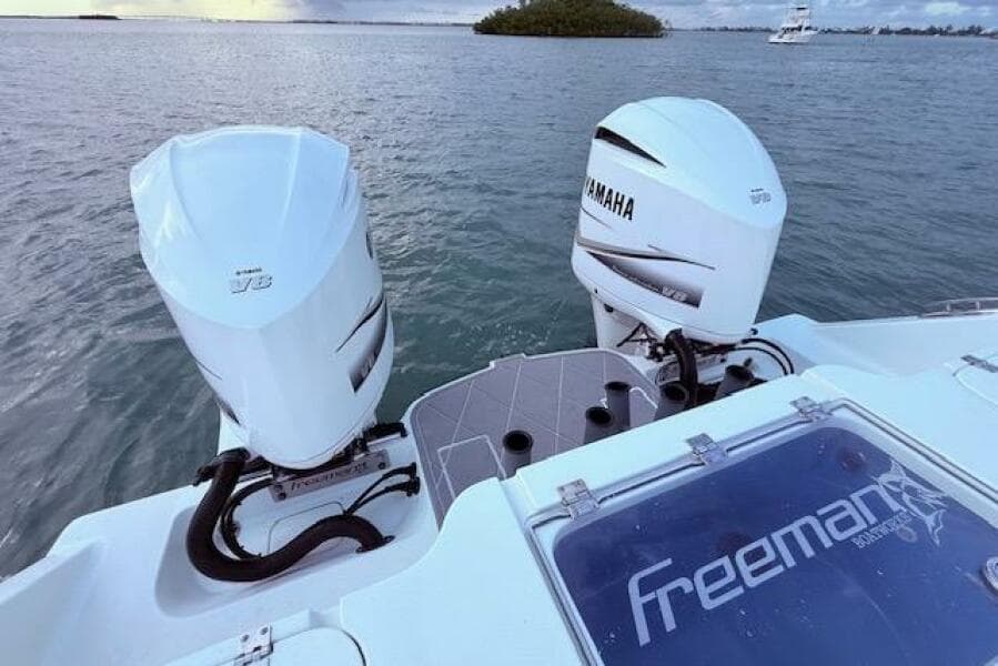 Freeman 34 boat with twin Yamaha outboard engines on a calm sea, 2019 model.