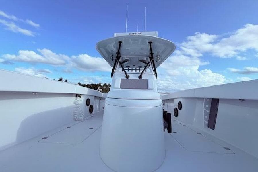 2019 Freeman 34 boat with Garmin equipment, clear sky, and ocean view.