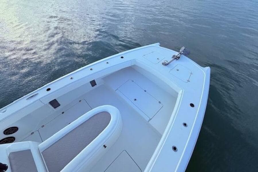 2019 Freeman 34 boat deck on calm water, showcasing spacious seating and storage.