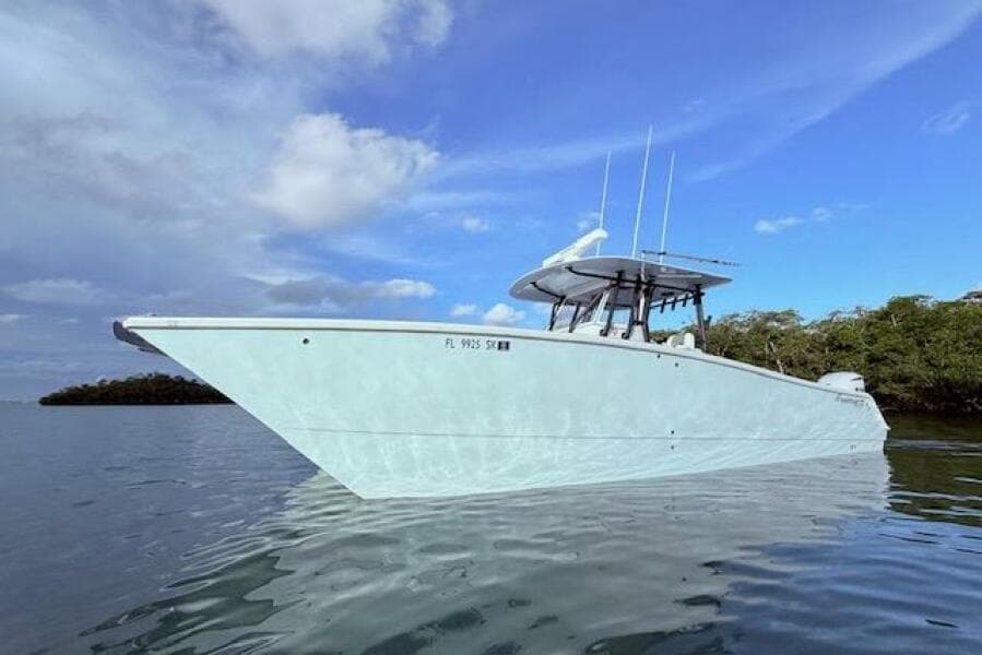 2019 Freeman 34 boat on calm water under a blue sky.