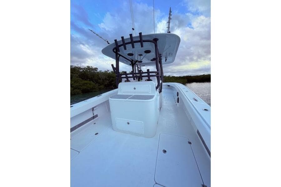 2019 Freeman 34 boat deck with center console, under a cloudy sky.