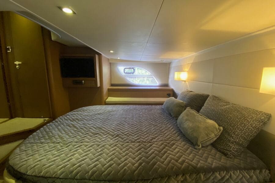 Luxurious cabin interior of 2014 Beneteau Gran Turismo 44 yacht with cozy bedding.