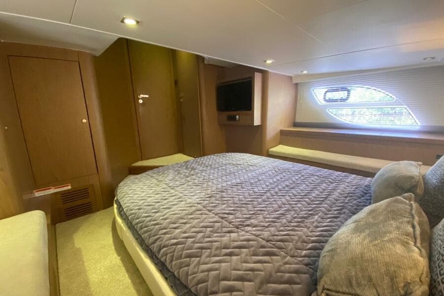 Luxurious cabin interior of 2014 Beneteau Gran Turismo 44 yacht with cozy bedding.