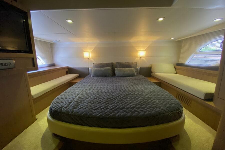 Luxurious cabin interior of 2014 Beneteau Gran Turismo 44 yacht with cozy bedding.