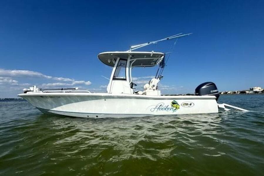 2018 Sea Hunt BX 25 FS boat on water under clear blue sky.