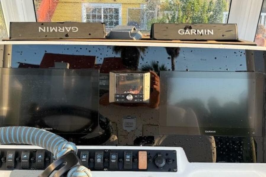Dashboard of 2018 Sea Hunt BX 25 FS with Garmin navigation displays.