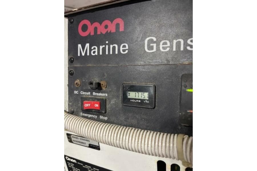 Onan marine generator panel on 2004 Carver 466 Motor Yacht, showing 1715 hours.