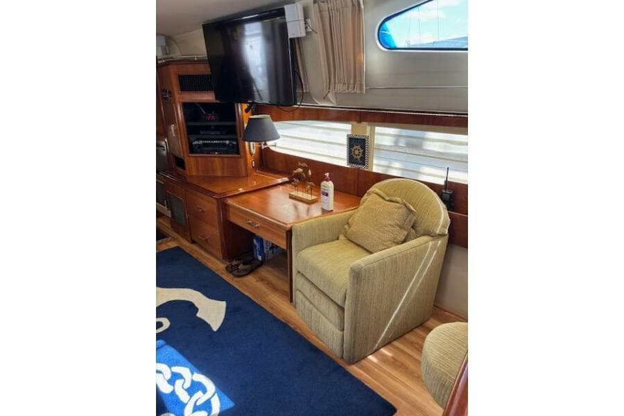 Interior of 2004 Carver 466 Motor Yacht with cozy seating and entertainment area.