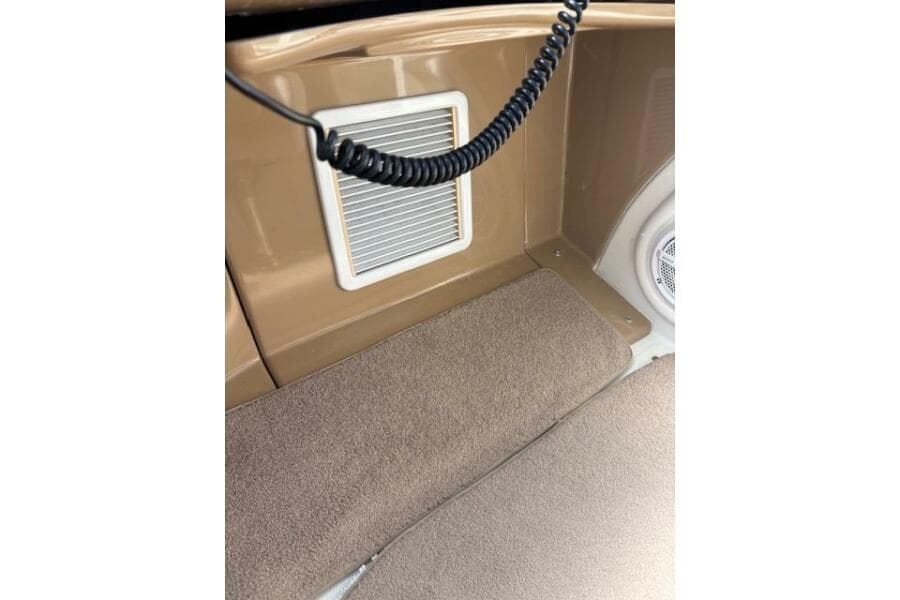 2004 Carver 466 Motor Yacht interior with vent and carpeted flooring.