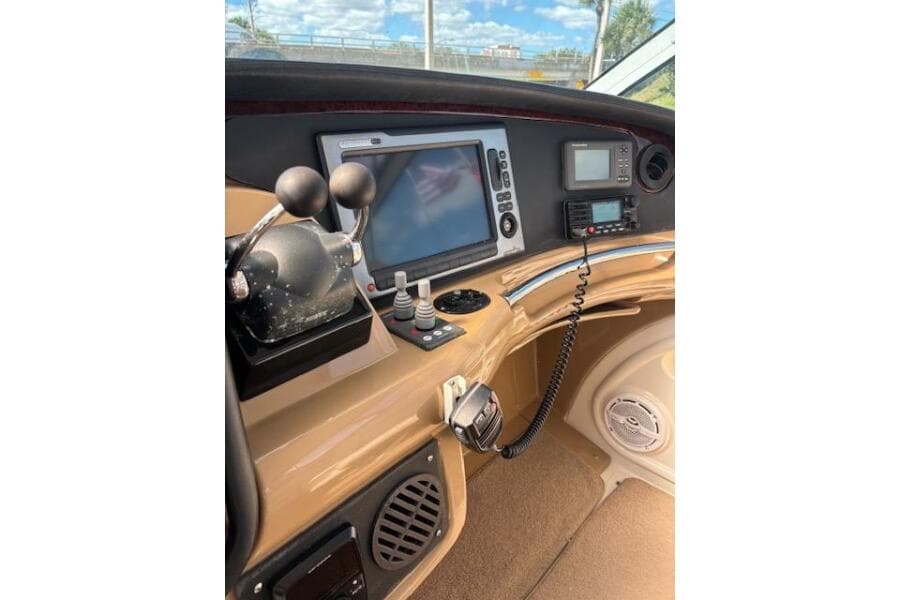 2004 Carver 466 Motor Yacht helm with navigation controls and communication equipment.