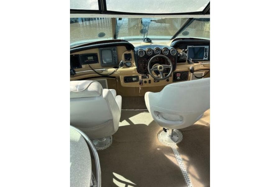 2004 Carver 466 Motor Yacht helm with dual seats and navigation instruments.