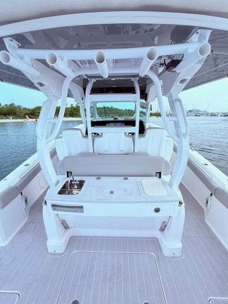 2024 Scout 400 LXF boat interior with seating and fishing rod holders.