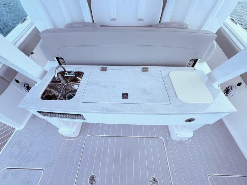 2024 Scout 400 LXF boat interior with sink and cutting board on deck.
