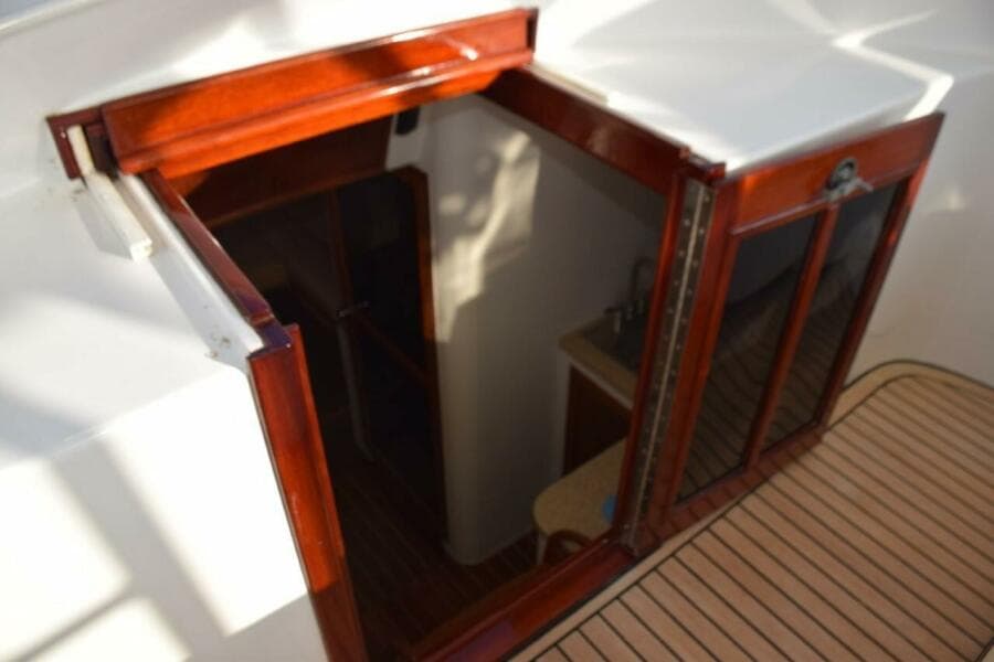 Locking Entry Door To Cabin, Teak And Glass Folding Door With Keeper And Slide Back Solid Top Panel.