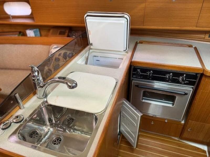 Galley with top and bottom fridge/freezer doors open