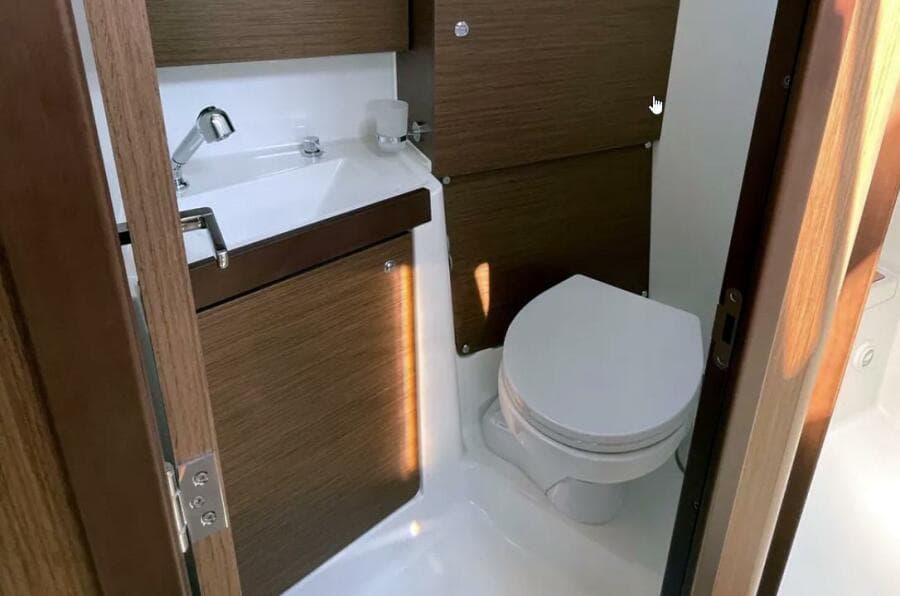 Head with toilet and sink