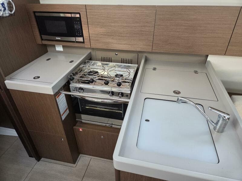 Galley with fridge/freezer, microwave, stove/oven, sink