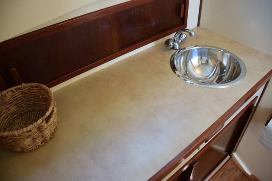 Storage Cabinet With Sliding Door Behind Countertop