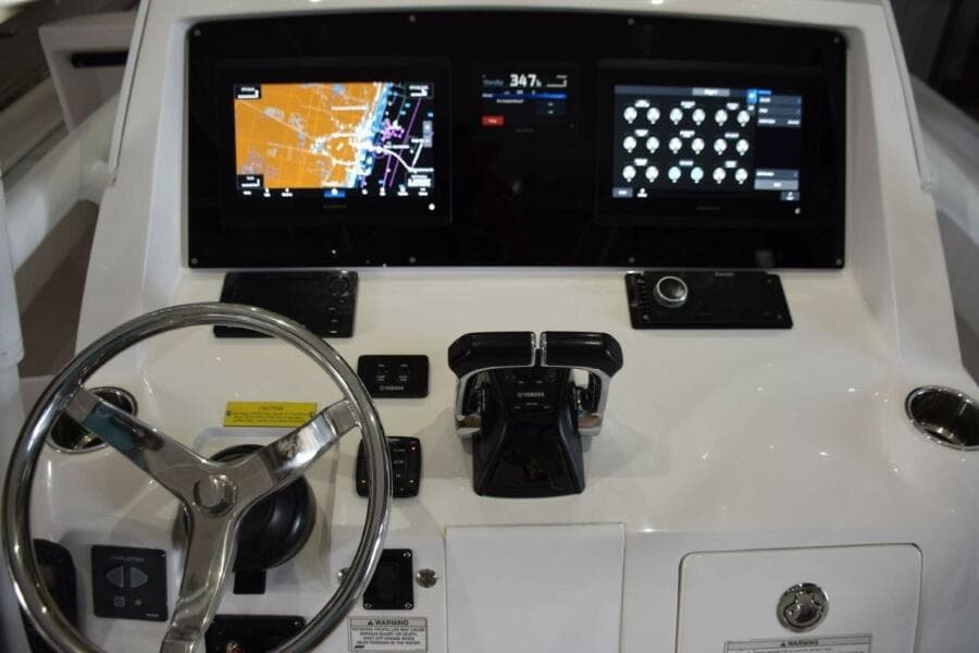 Dual Garmin 12 Inch Displays With Garmin Autopilot Between. Digital Switching For Boat Systems Via Garmin.