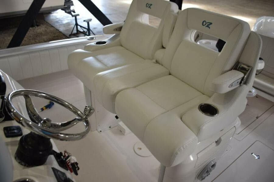Ocean Elite Helm Seat Console With Fold Down Armrests And Drink Holders.