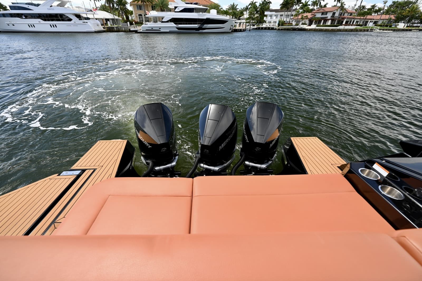 Triple Mercury Outboards and Aft Lounge